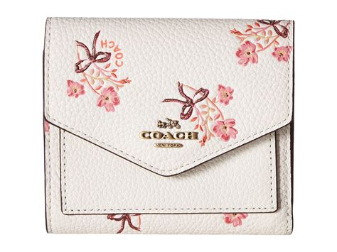 coach floral bow print wallet.